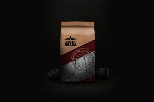 Redesign of the paper packaging for Bom de Brasa charcoal, featuring strong graphics and typography optimized for the export market. Packaging design project by ENTRE Design.